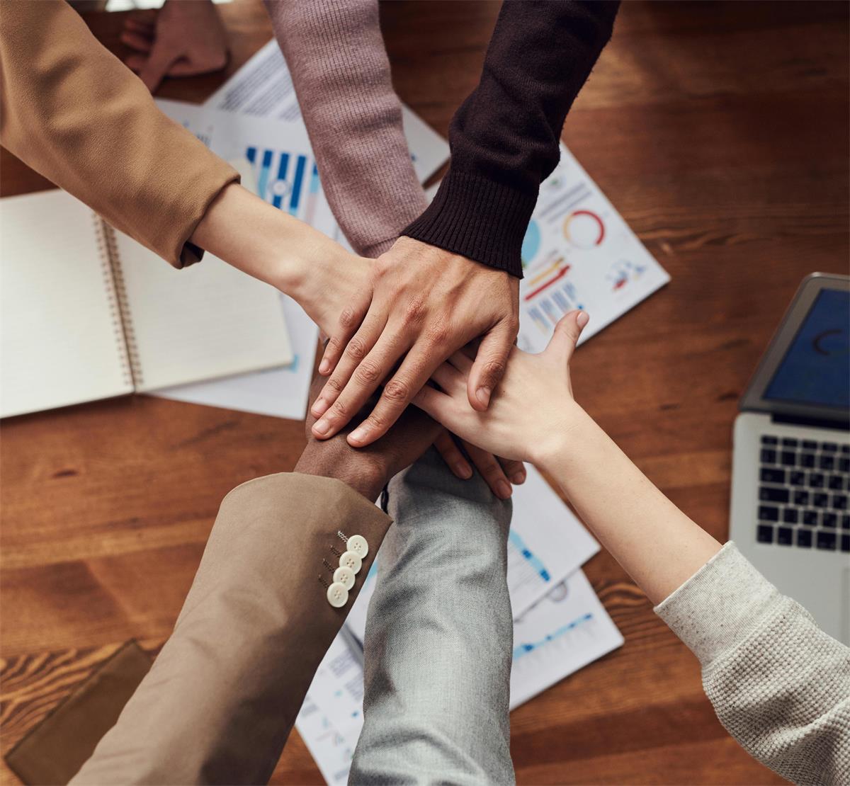 Hands in over a desk